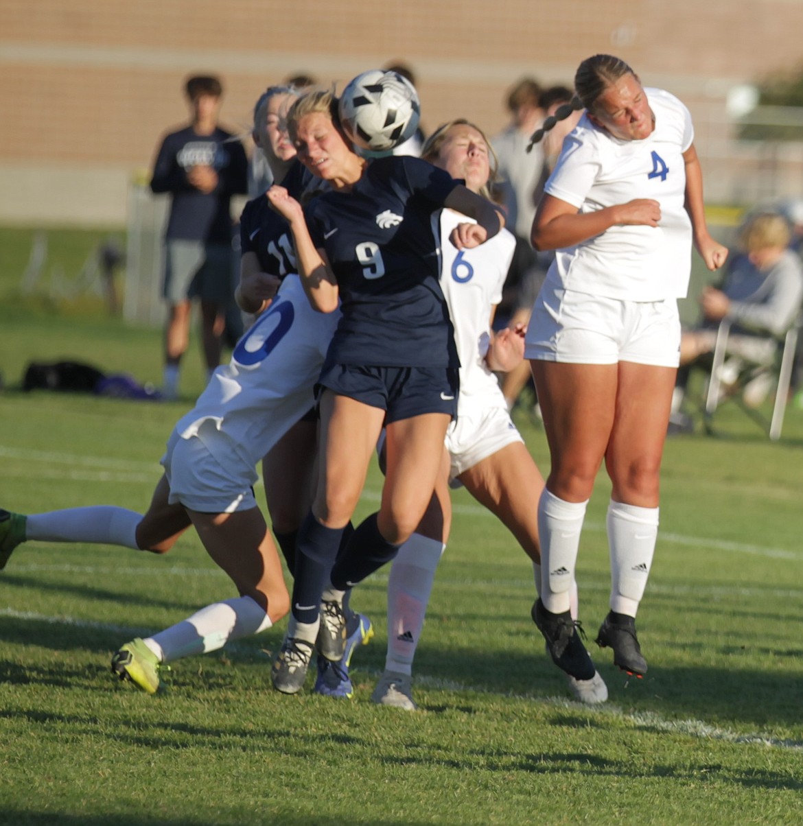 JASON ELLIOTT/Press
Lake City senior midfielder MacKenzie Goings (9) and Coeur d'Alene junior midfielder Ella Morton (4) attempt to play a corner hit in the air during the second half of Tuesday's 5A Region 1 girls soccer championship match at the Irma Anderl Soccer Complex.