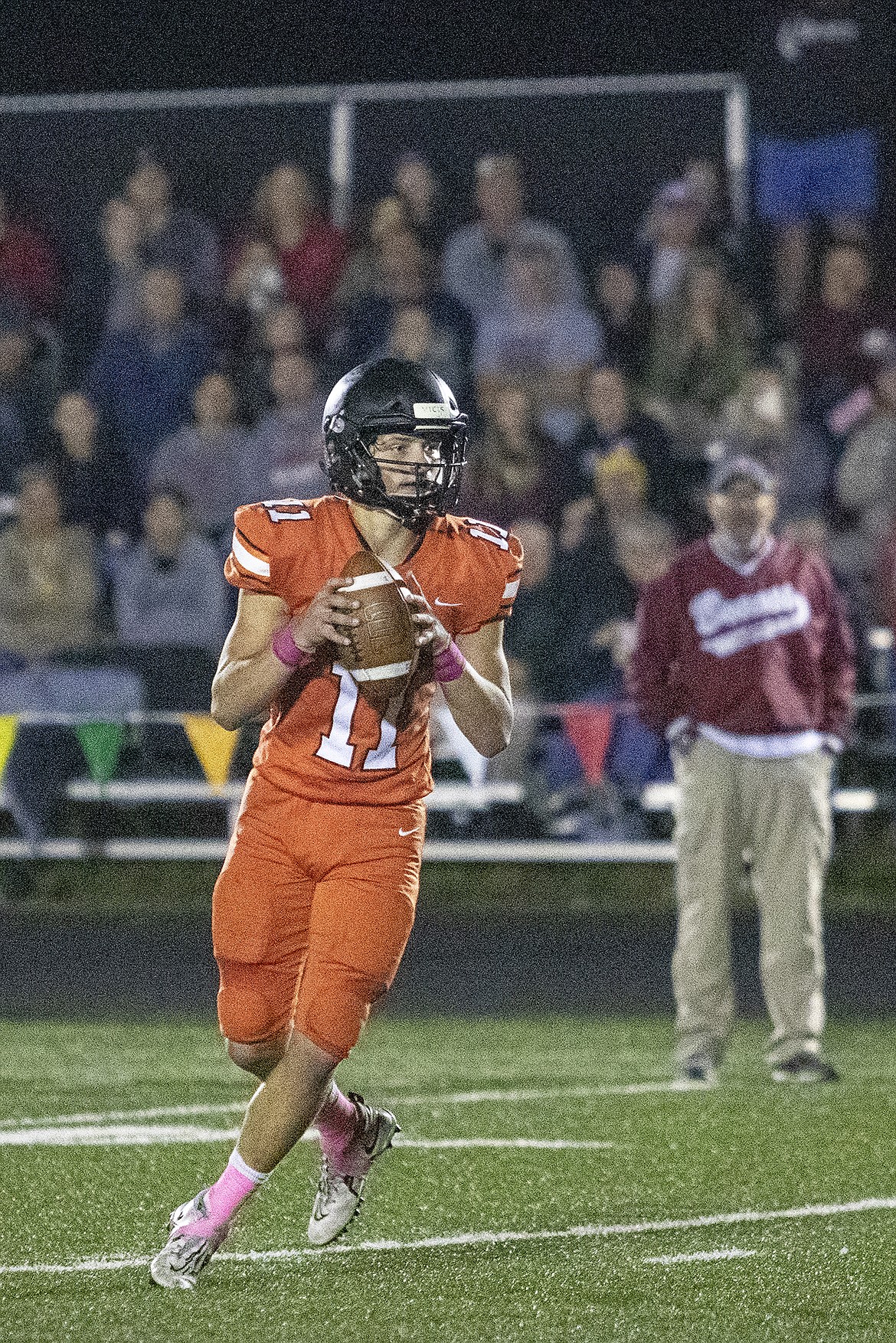 Ronan quarter back Caleb Cheff looks down field for an open receiver. (Rob Zolman/Lake County Leader)