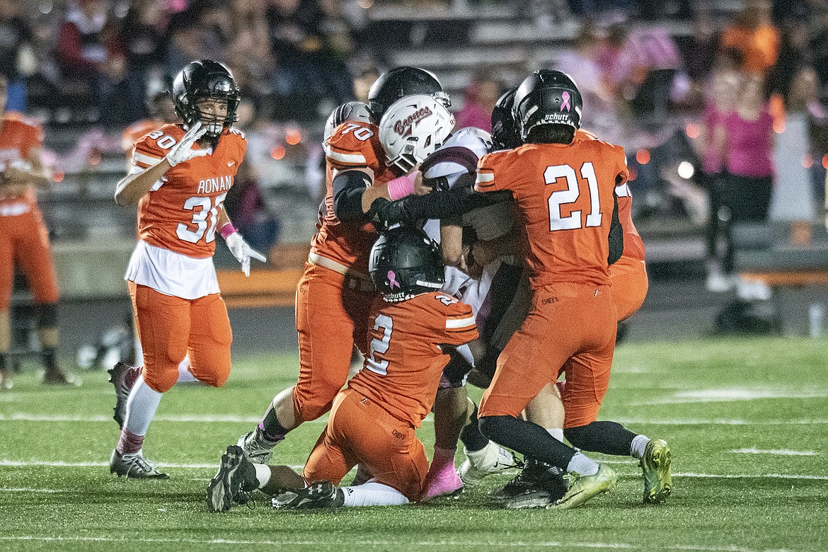 The Hamilton Bronc running back is corralled by the Chiefs’ defense. (Rob Zolman/Lake County Leader)