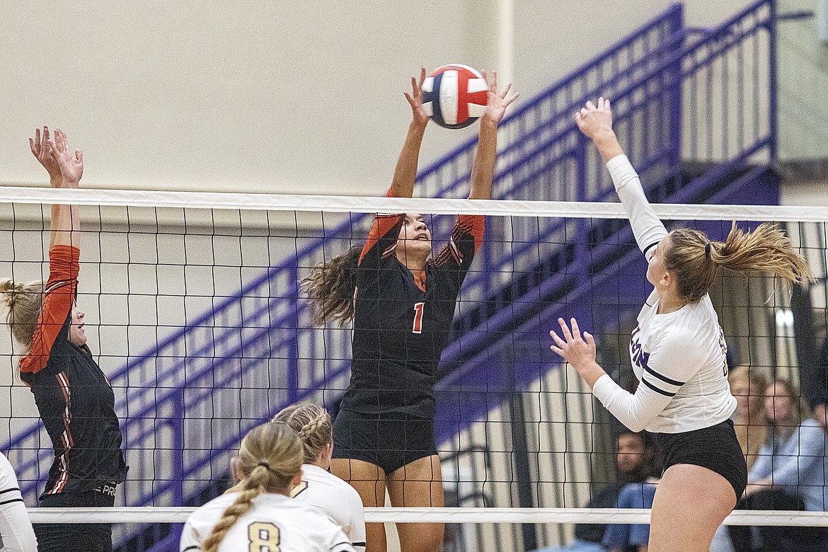 Ronan Maiden Leina Ulutoa blocks a spike. (Rob Zolman/Lake County Leader)