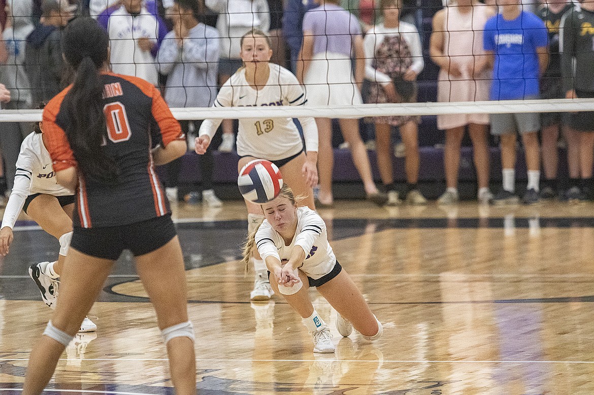 Lady Pirate Lucy Violett dives for the ball during a match at Linderman Gym against cross county rival Ronan Maidens on Thursday. (Rob Zolman/Lake County Leader)