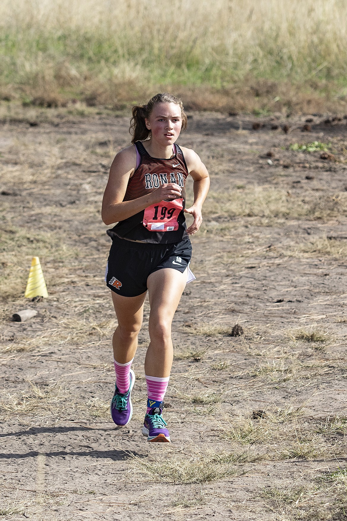 Ronan Maiden Olivia Heiner with a time of 21:12 finishes second during the Mission Shadow Duels hosted at the Silver Fox Golf Course in Pablo on Saturday. (Rob Zolman/Lake County Leader)