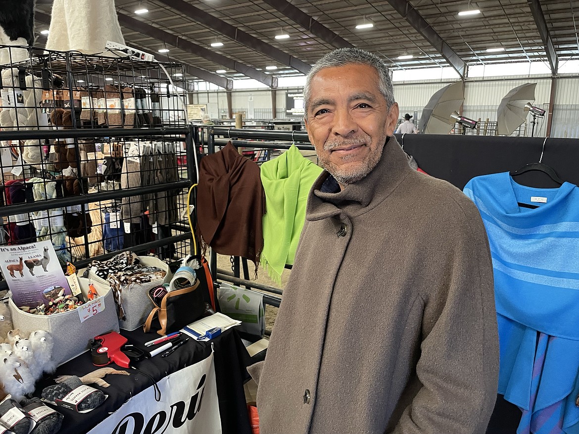 Juan Espinoza, with Salem, Oregon-based Piel Canela Peru, wears an alpaca wool coat, one of many of the fine alpaca wool goods his company imports from Peru.