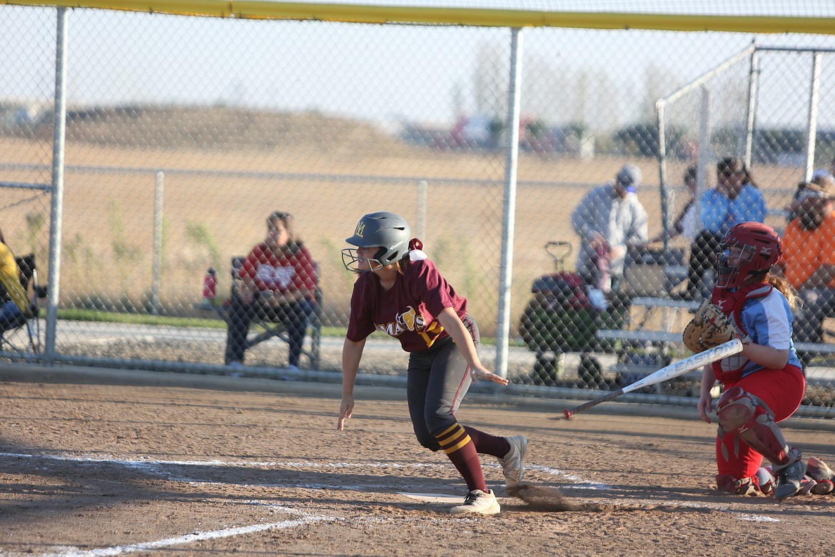 Moses Lake senior Jadelyn Balderas tosses her bat aside after making contact with a pitch.