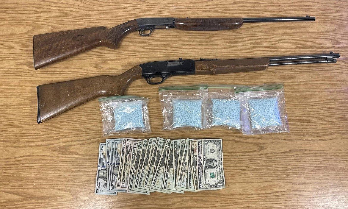 Some of the pills, cash and two firearms seized during a search of a residence in Othello on Oct. 10 by an Adams County Sheriff’s Office team.