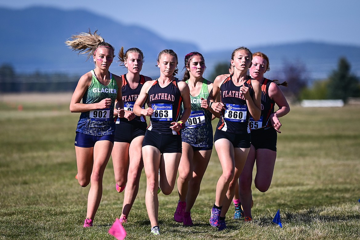 From left, Glacier's Alyssa Vollersten, Flathead's Afton Wride, Flathead's Josie Wilson, Glacier's Anna Tretter, Flathead's Lindy Porter and Flathead's Bailey Wride run the course during the Glacier Invite at Rebecca Farm on Wednesday, Oct. 12. (Casey Kreider/Daily Inter Lake)