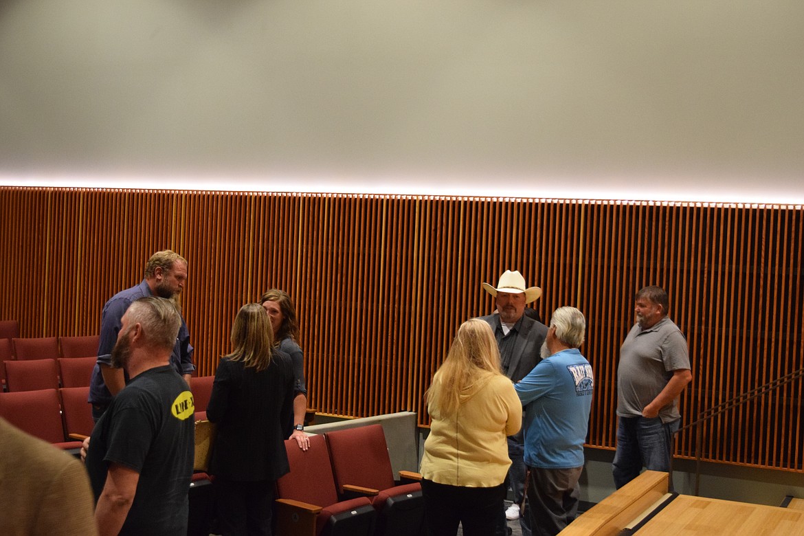 Grant County Sheriff Candidate Joe Harris, in cowboy hat, speaks with attendees at a candidate forum hosted by the Moses Lake Chamber of Commerce and the Columbia Basin Herald. Harris, his opponent Joey Kriete, and candidates for other offices stuck around after the forum to speak with attendees.