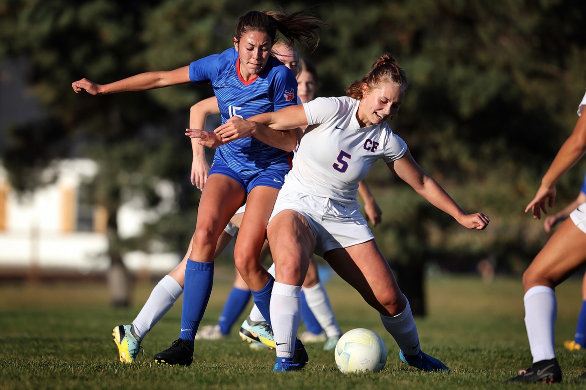 Columbia Falls' Kyra Bruner (5) holds off Bigfork's Braeden Gunlock (15) in a Northern A play-in game in Bigfork on Tuesday, Oct. 12. (Jeremy Weber/Bigfork Eagle)