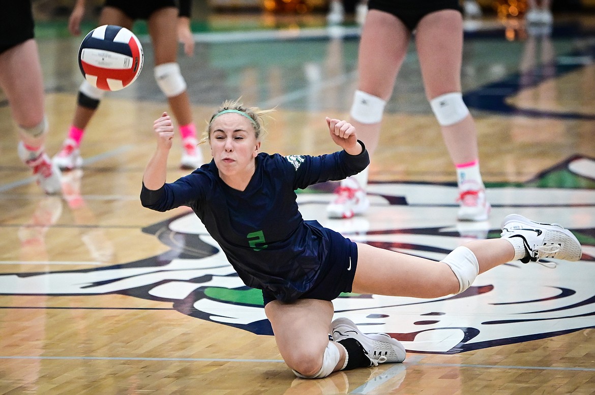 Glacier's Kaylie Field (2) makes a one-handed dig diving away from the net against Flathead at Glacier High School on Thursday, Oct. 13. (Casey Kreider/Daily Inter Lake)