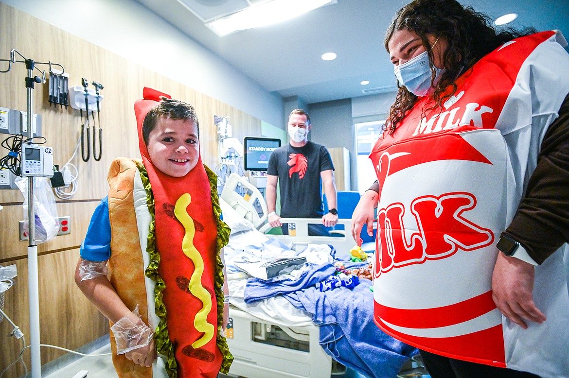 Cash Norwalt tries on a hot dog costume during the Spirit of Children visit at Logan Health Children's in Kalispell on Thursday, Oct. 13. The Child Life team at Logan Health Children's handed out costumes and treats donated by Spirit Halloween to allow children in the hospital the chance to celebrate Halloween. Spirit of Children supports Child Life Departments operating in local hospitals and in two years has raised over $49,000 for Logan Health Children’s. (Casey Kreider/Daily Inter Lake)