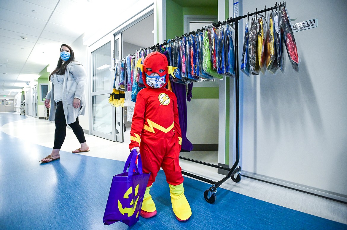 Leo Norwalt walks down the hallway in his new Flash superhero costume during the Spirit of Children visit at Logan Health Children's in Kalispell on Thursday, Oct. 13. The Child Life team at Logan Health Children's handed out costumes and treats donated by Spirit Halloween to allow children in the hospital the chance to celebrate Halloween. Spirit of Children supports Child Life Departments operating in local hospitals and in two years has raised over $49,000 for Logan Health Children’s. (Casey Kreider/Daily Inter Lake)