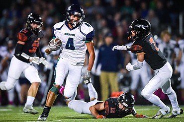 Glacier wide receiver Kole Johnson (4) heads to the end zone on a 57-yard touchdown reception in the first quarter against Flathead at Legends Stadium on Friday, Oct. 14. (Casey Kreider/Daily Inter Lake)
