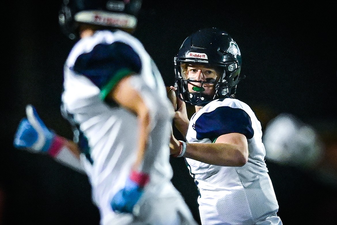 Glacier quarterback Gage Sliter (7) drops back to pass in the first quarter against Flathead at Legends Stadium on Friday, Oct. 14. (Casey Kreider/Daily Inter Lake)