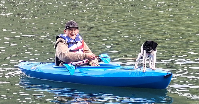 Nick Franssen, son of Cast, Blast and Relax owners Nick and Tabetha Franssen, enjoys kayaking with puppy Maggie. Cast, Blast and Relax offers recreation and outdoor gear, equipment rentals and concessions. It will soon be open in the Silver Lake Mall for the Christmas season.