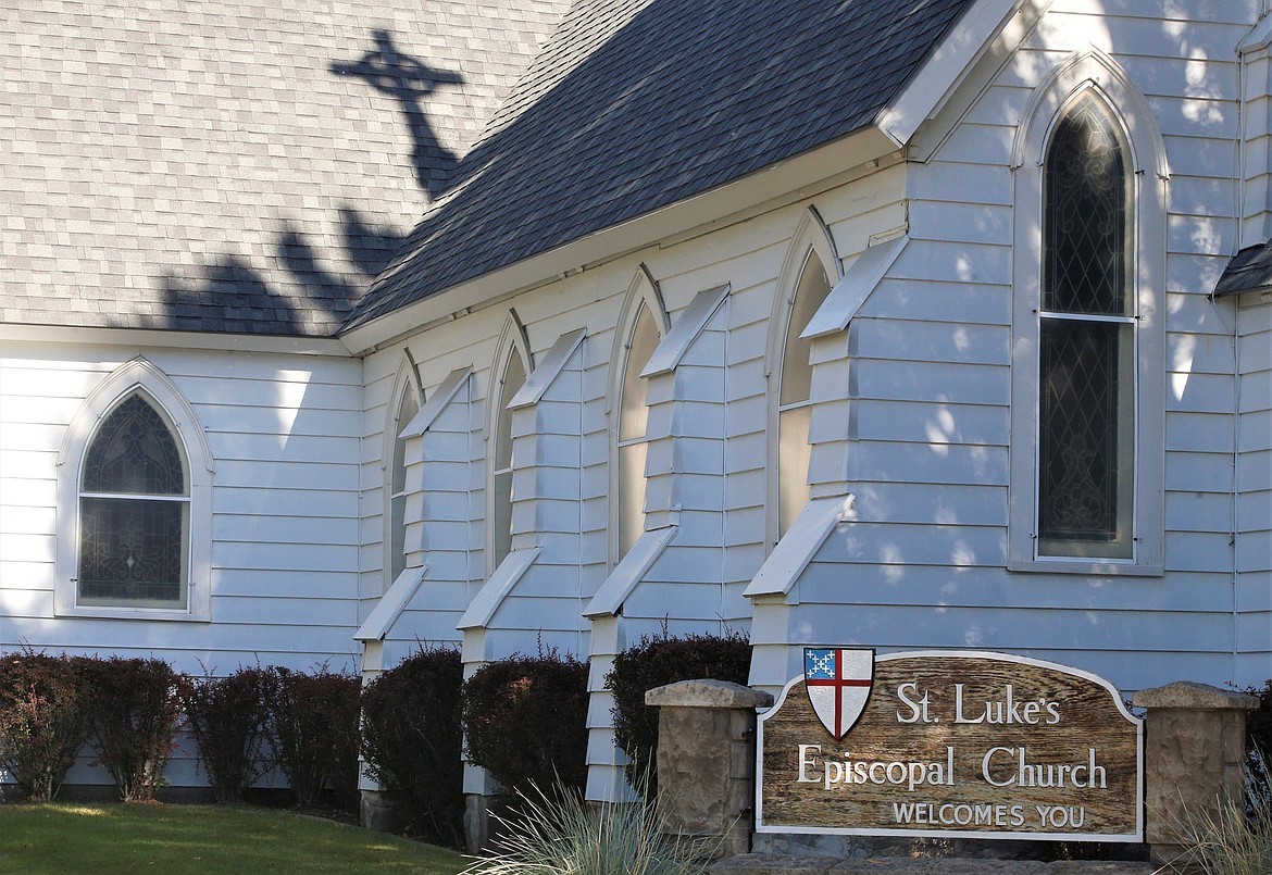 The shadow of a cross falls on the roof at St. Luke's Episcopal Church in Coeur d'Alene on Friday.
