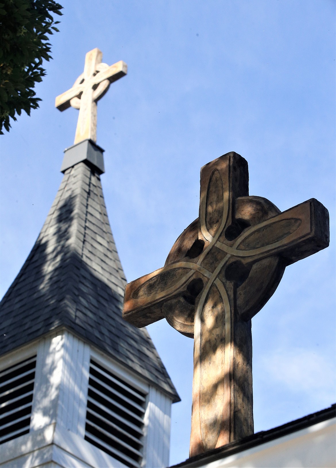 A cross stands high above the entry to St. Luke's Episcopal Church in Coeur d'Alene.