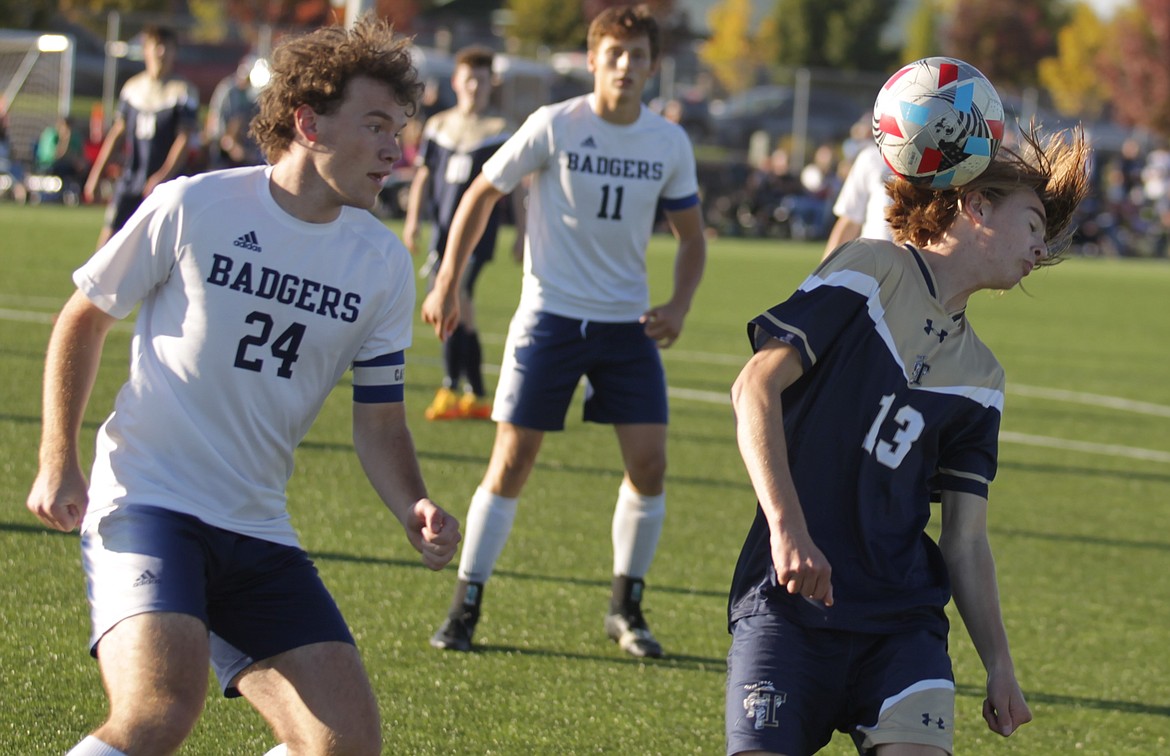 JASON ELLIOTT/Press
Timberlake sophomore midfielder Haidyn Jonas plays the ball off of his head while Bonners Ferry senior Porter Schulte defends during the first half of the 3A District 1-2 boys soccer championship match at The Fields in Post Falls on Saturday.