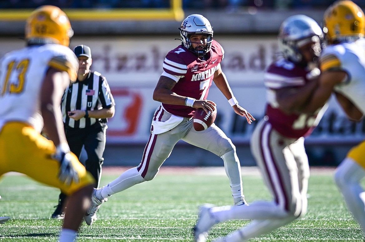 Montana quarterback Lucas Johnson (7) rolls out looking for an open receiver in the fourth quarter against Idaho at Washington-Grizzly Stadium on Saturday, Oct. 15. (Casey Kreider/Daily Inter Lake)
