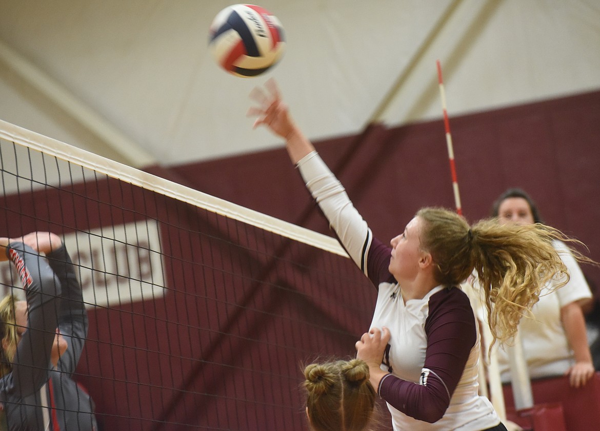 Troy volleyball player Elaine Folkerts delivers a kill against Arlee on Saturday, Oct. 15. (Scott Shindledecker/The Western News)