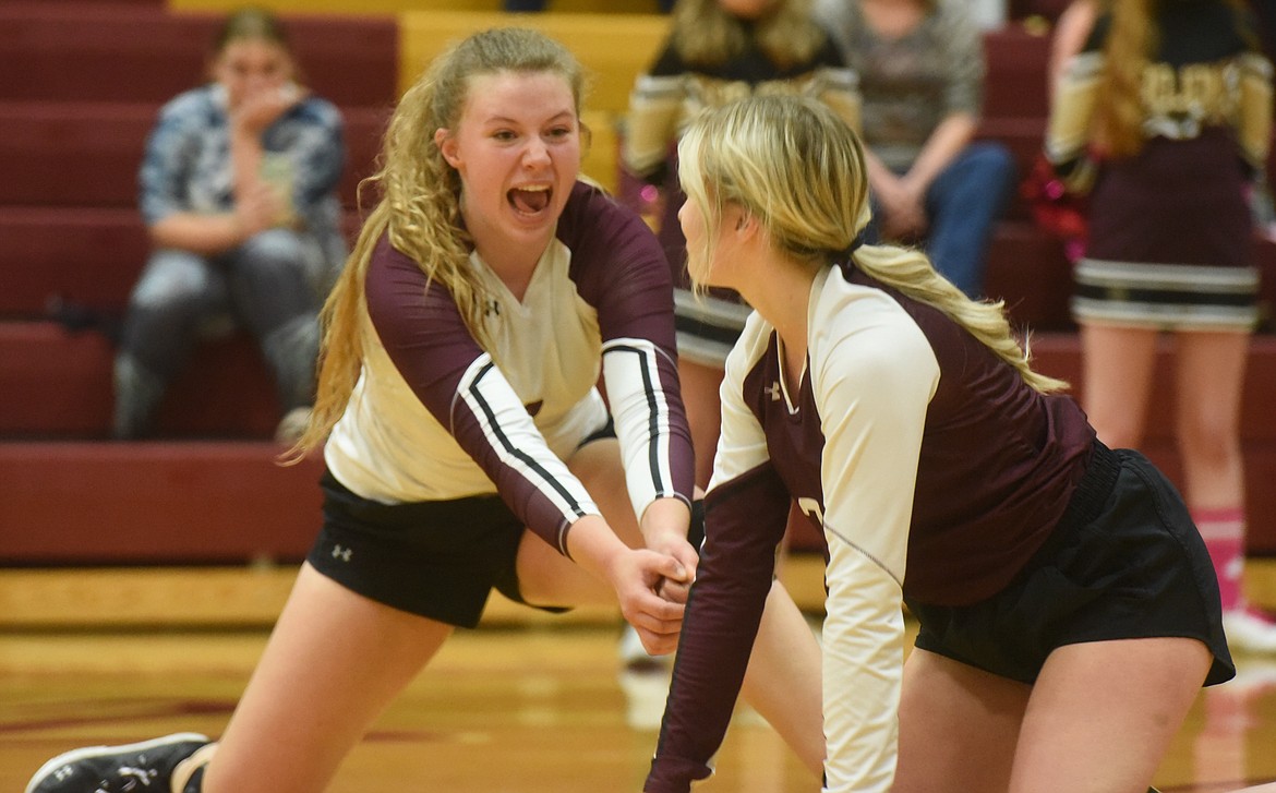 Troy volleyball players Elaine Folkerts and Audrianna Borgmann each try for a dig against Arlee on Saturday, Oct. 15. (Scott Shindledecker/The Western News)