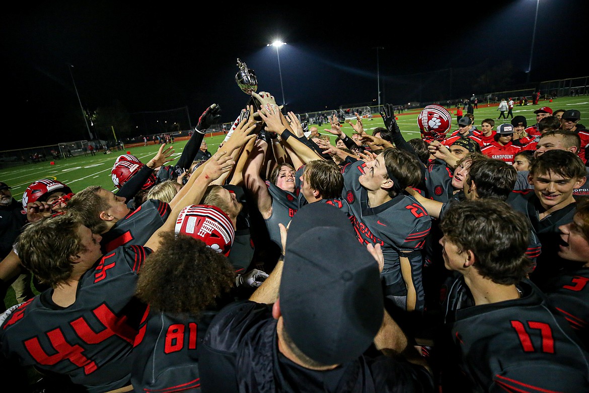 The Bulldogs raise the trophy after winning the Inland Empire League title after defeating Moscow, 67-0.