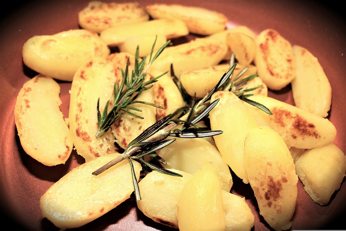 In lieu of rice, add some heartiness to your meal by combining small, young potatoes with garden herbs.
