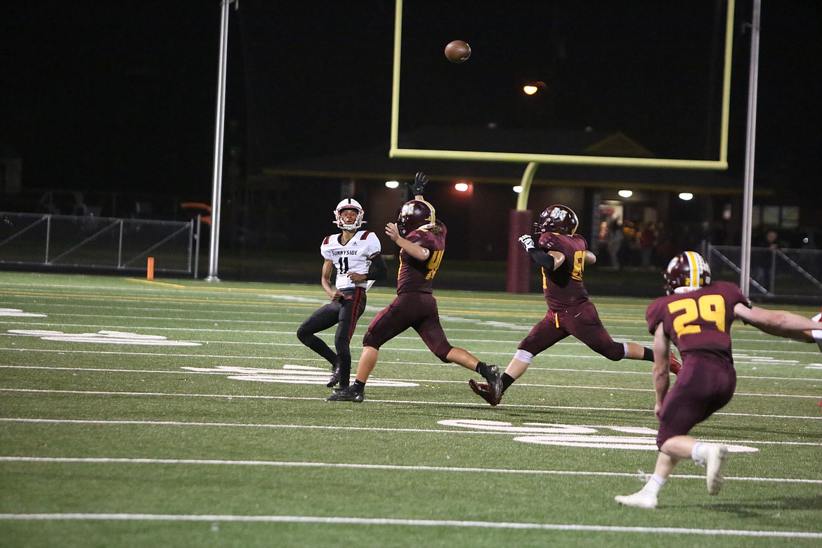 Sophomore linebacker Noah Burns and senior defensive lineman Camden Stout chase after Sunnyside quarterback Brent Maldonado as he rolls out of the pocket.