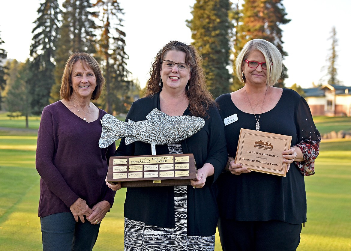 The Whitefish Community Foundation presented the prestigious Great Fish Award along with its associated $7,500 grant to the Flathead Warming Center on Monday Evening. Pictured, from left to right, is WCF Board Chair Ardy Whisler, Flathead Warming Center Executive Director Tonya Horn and Flathead Warming Center Resource Coordinator Jody Waggener. (Whitney England/Whitefish Pilot)