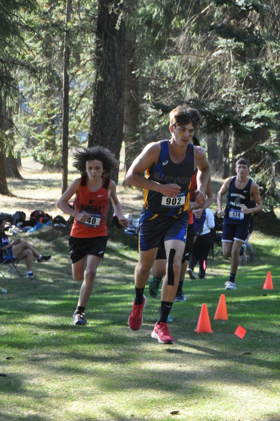 Thompson Falls runner JT Taylor runs through the woods at the River's Bend Golf Course west of town during last week's Western B/C cross country meet. (Photo by coach Sarah Naegeli)