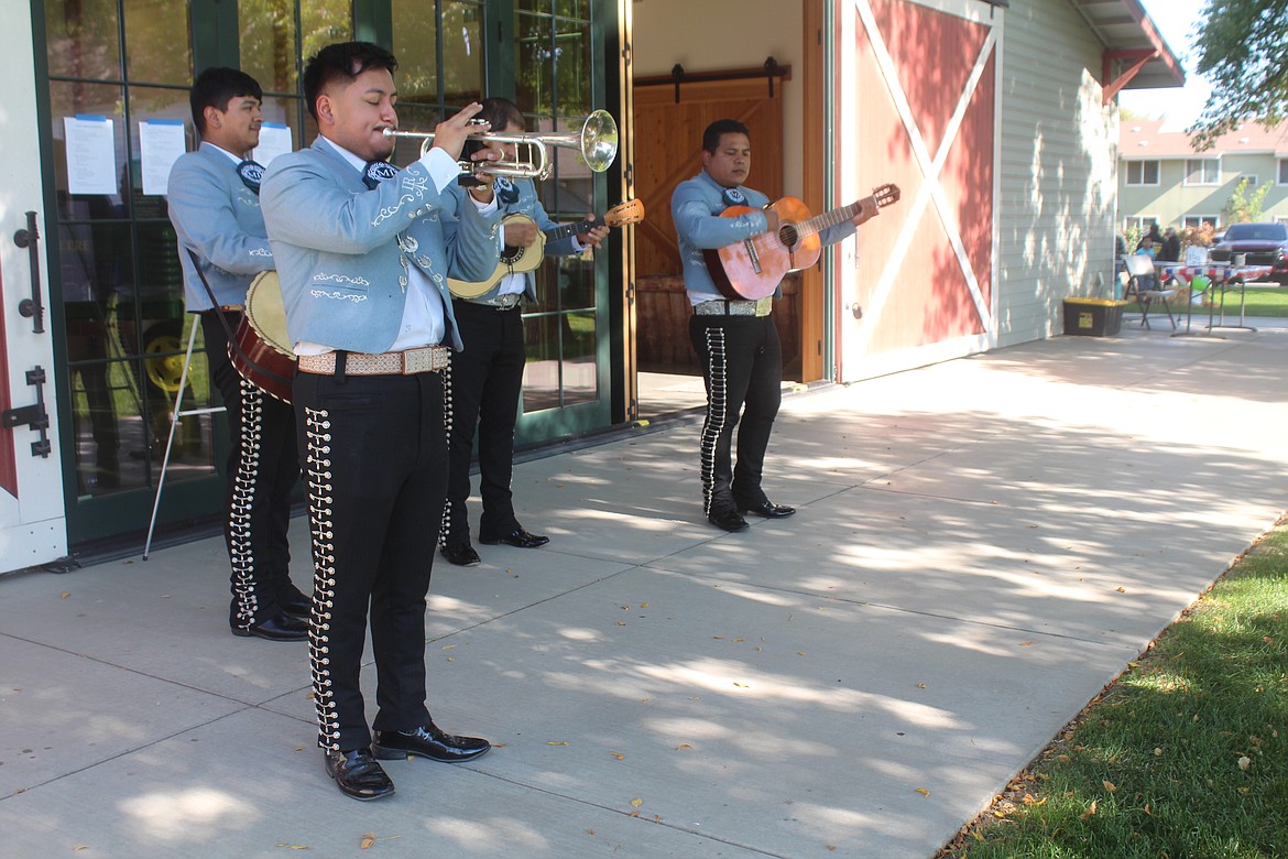 Jose Machado, founder and leader of Mariachi Imperio, leads the group during a performance Saturday at the “Celebration of Cultures” at the Quincy Valley Historical Society and Museum.