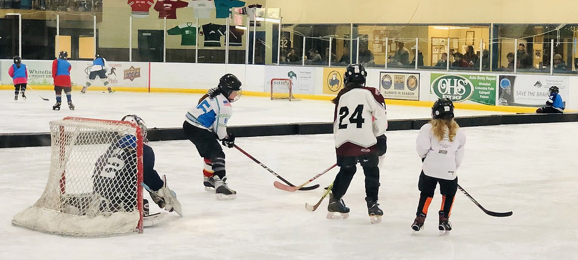 Girls play during the Fall Into Hockey program this September at the Stumptown Ice Den. (Photo provided)