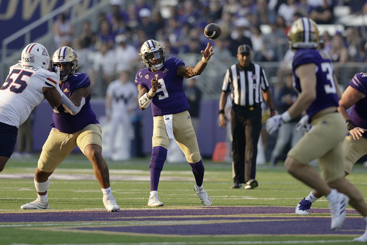 University of Washington quarterback Michael Penix Jr. (9) threw for 516 yards in the Huskies’ 49-39 win over Arizona on Saturday, a program-high.