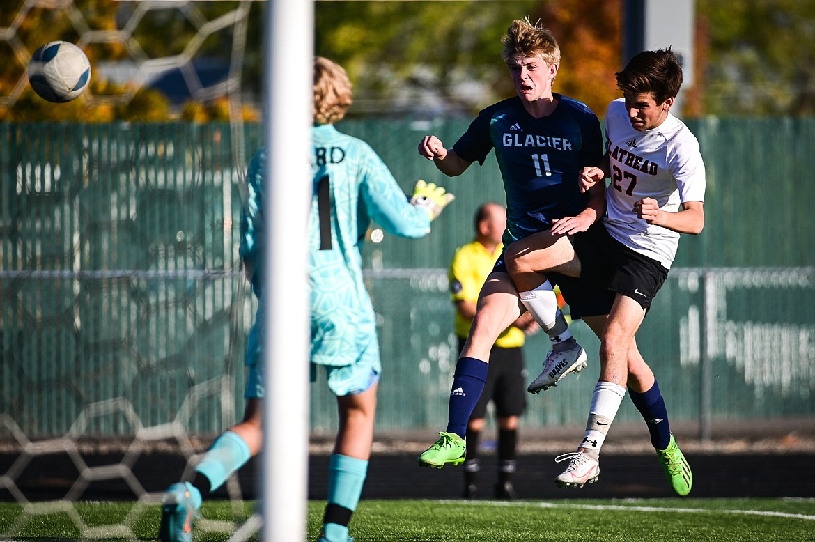 Flathead's Miller Bushnell (27) defends against Glacier's Liam Ells (11) as Ells sends a shot wide of the net in the second half of a playoff game at Legends Stadium on Tuesday, Oct. 18. (Casey Kreider/Daily Inter Lake)