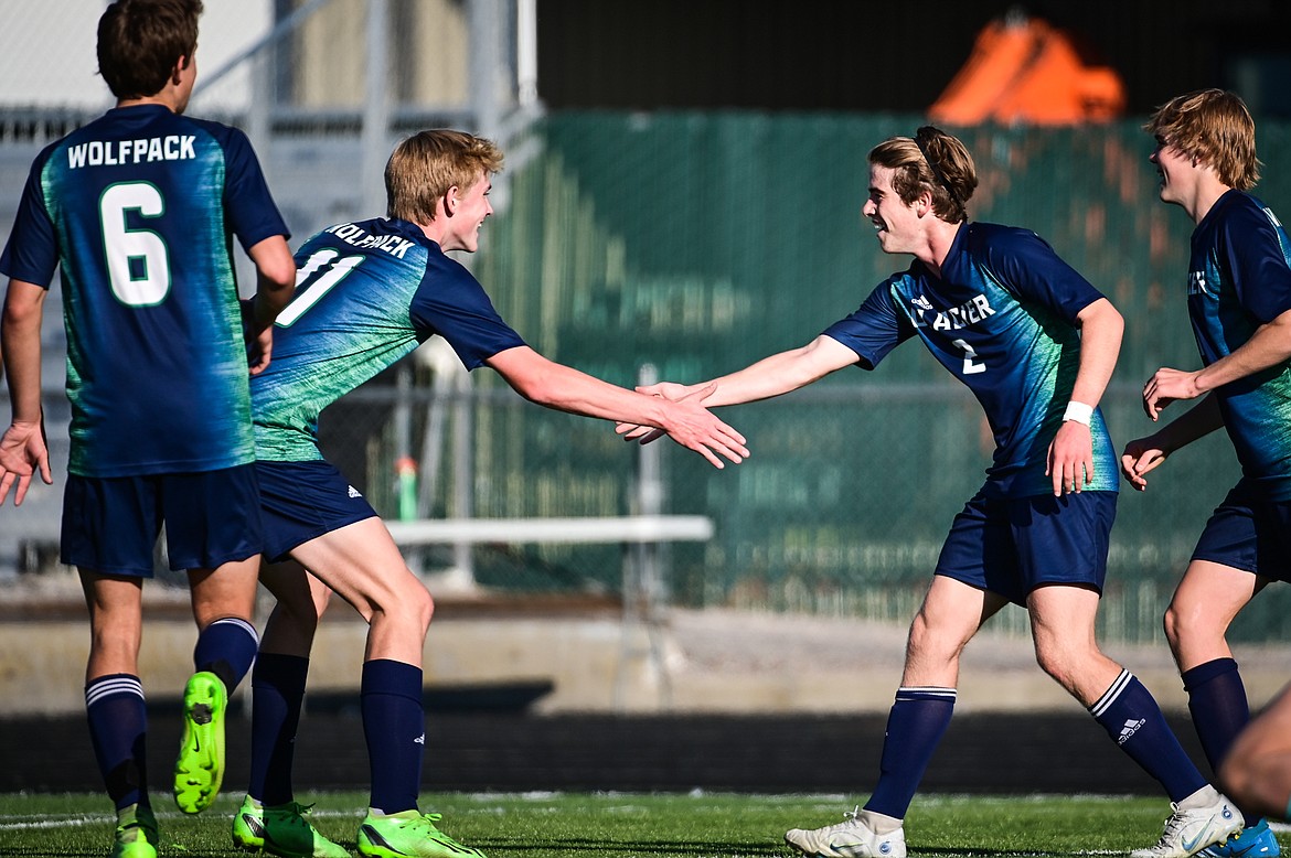 Glacier's Liam Ells (11) congratulates Harrison Sanders (2) after Sanders' goal in the first half against Flathead at Legends Stadium on Tuesday, Oct. 18. (Casey Kreider/Daily Inter Lake)