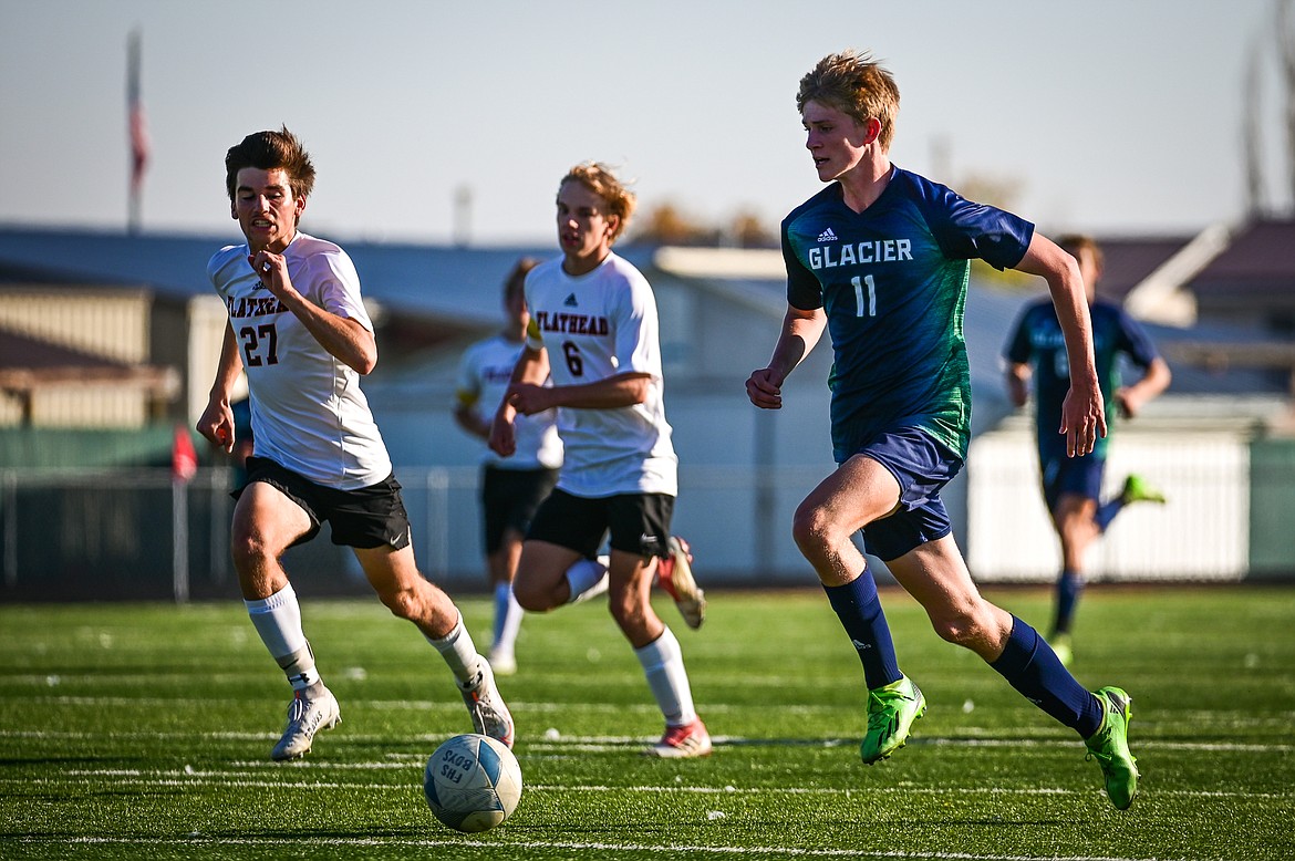 Glacier's Liam Ells (11) pushes the ball upfield against Flathead at Legends Stadium on Tuesday, Oct. 18. (Casey Kreider/Daily Inter Lake)