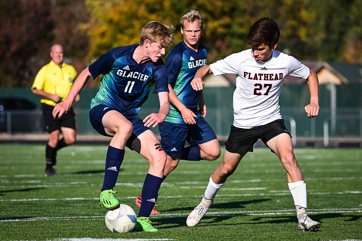 Glacier's Liam Ells (11) pushes the ball upfield against Flathead at Legends Stadium on Tuesday, Oct. 18. (Casey Kreider/Daily Inter Lake)