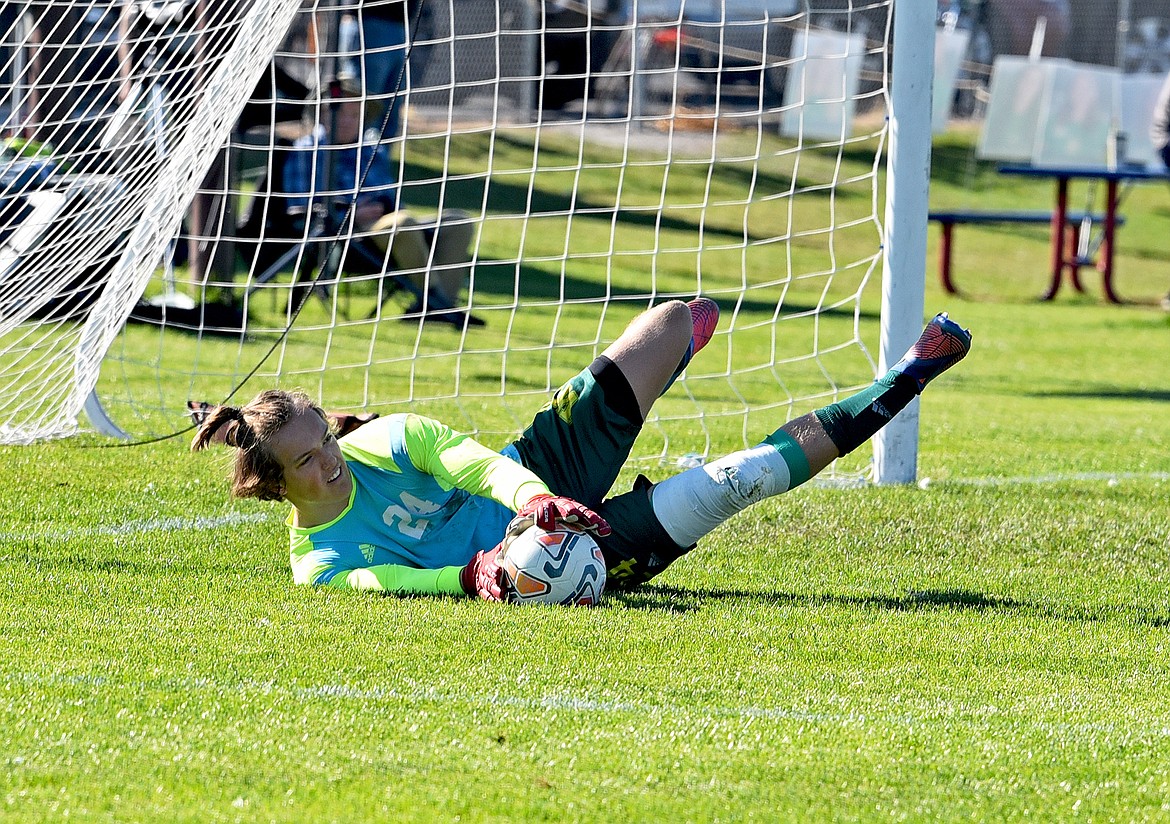 Whitefish goalkeeper Ethan Schott makes a save during a Class A quarterfinal playoff game against Hamilton on Saturday at Smith Fields. (Whitney England/Whitefish Pilot)