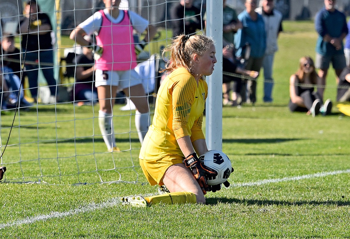 Whitefish goalkeeper Norah Schmidt makes the winning save in a penalty kick shootout against Laurel in the Class A quarterfinal playoff game on Saturday at Smith Fields. (Whitney England/Whitefish Pilot)