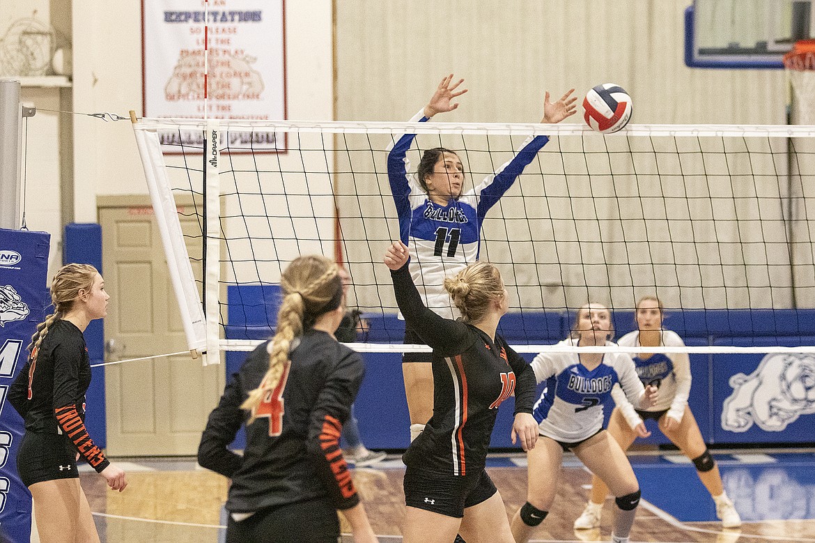 Mission Lady Bulldog Rowan McElderry taps the ball back over the net. (Rob Zolman/ Lake County Leader)