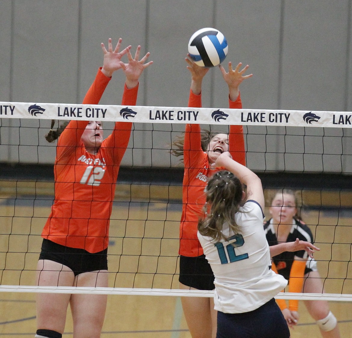 MARK NELKE/Press
Sam Anderson (12) and Trinity Byrne of Post Falls go up for the block against Aubrey Stennett (12) of Lake City in the 5A Region 1 volleyball championship match Tuesday night at Lake City.