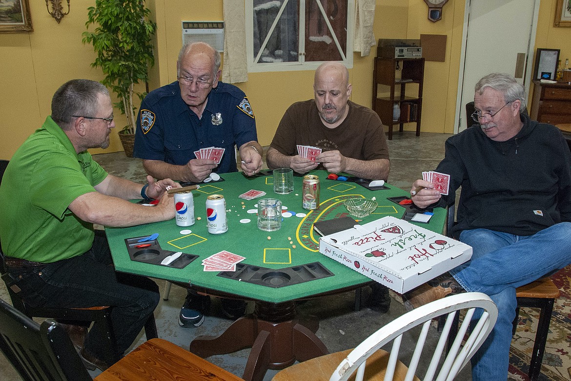 Members of the Poker Gang (John Goroski, David Vale, Mike Robertson, and Daron Fisler) worry that Felix may do something crazy.