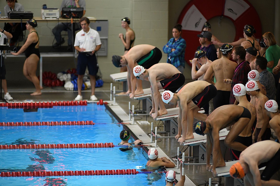 Sandpoint High School men's swim team members get ready for a race at Saturday's final meet of the season. The team finished the meet in first place.