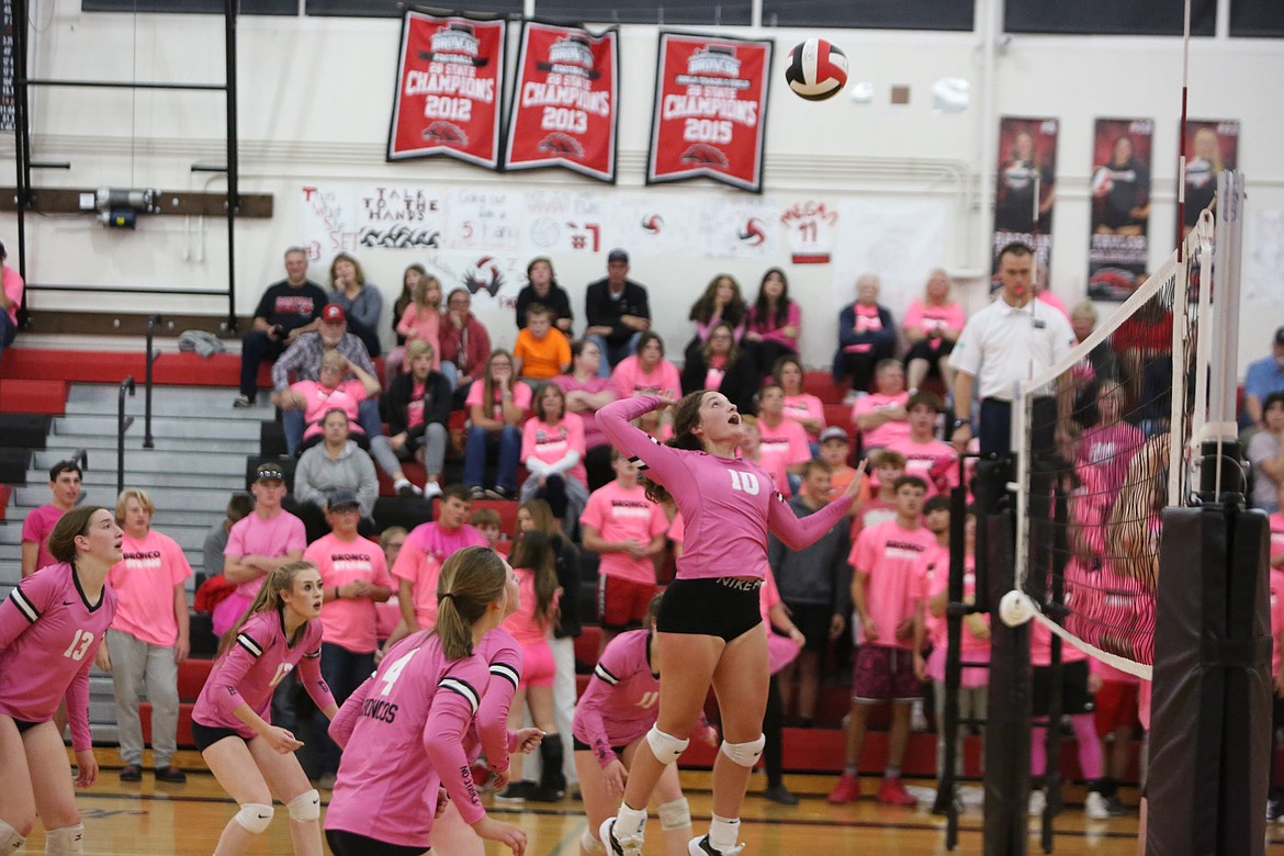 Bronco sophomore Saige Galbreath leaps in the air for a spike during the fourth set of the win over Davenport.