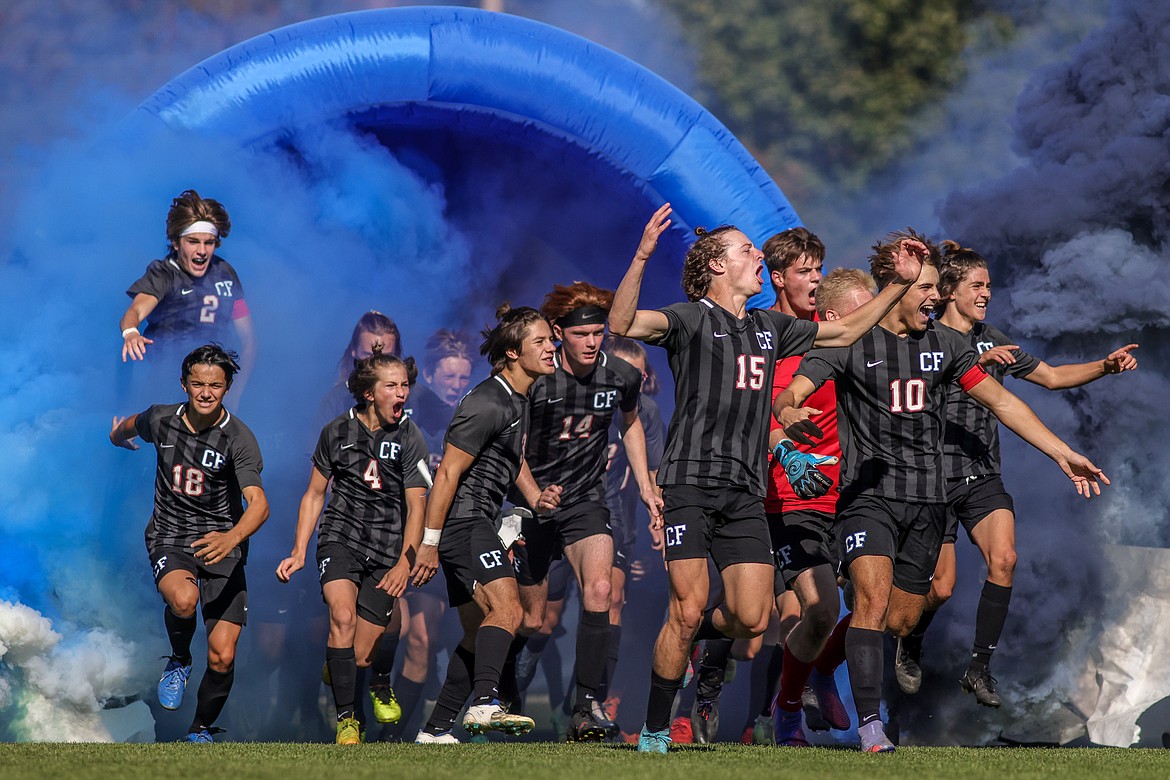 The Columbia Falls boys soccer team enters the field Saturday. (JP Edge photo)