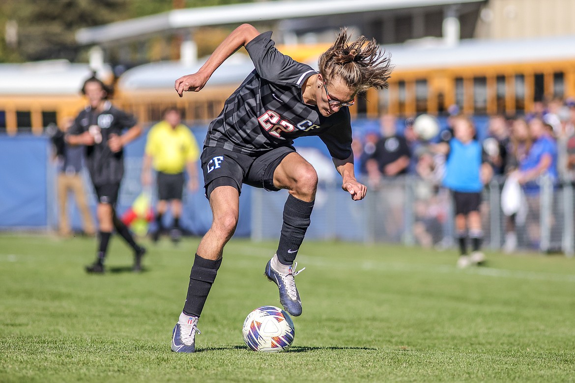 Finley Sundberg touches the ball around Billings' defenders on Saturday at home in the quarter final game. (JP Edge photo)