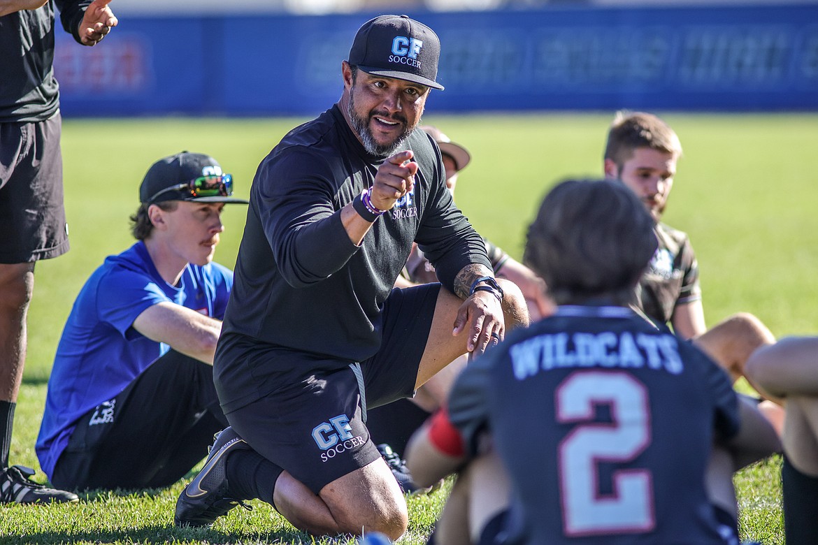 Head coach of the Wildcats, O'brien Byrd gives his team a motivational talk when the game was tied at halftime in the quarter final game against Billings Central. (JP Edge photo)