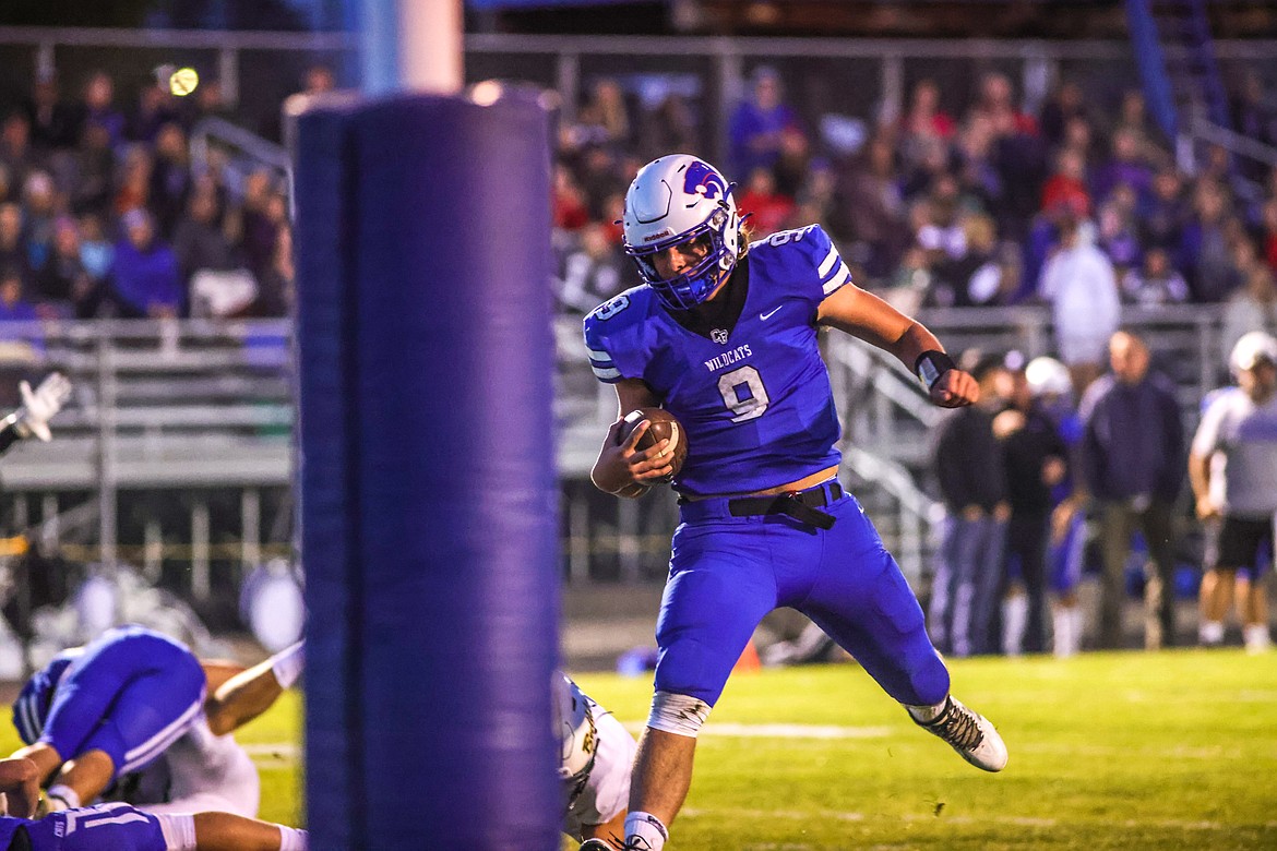 Wildcat's quarterback Cody Schweikert rushes for a touchdown on the opening drive against the Bulldogs on Oct. 14 in Columbia Falls. (JP Edge photo)