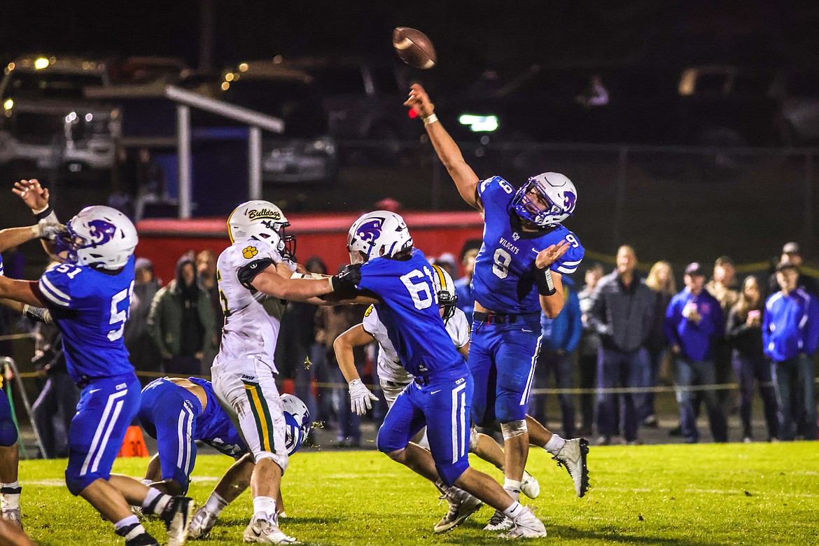 Junior quarterback Cody Schweikert leads a well-fought victory over the Bulldogs for the Wildcats on Oct. 14 in Columbia Falls. (JP Edge photo)