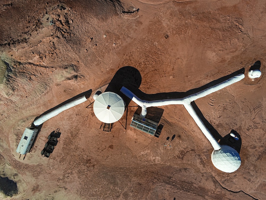 An overview of the martian simulation station in Hanksville Utah, where scientists and astronauts train in an environment designed to mimic the surface of Mars. The Mars Desert Research Station is used as a training ground for courses funded by NASA, the Mars Society, and donors to equip elementary teachers to inspire their students for future missions to the red planet.