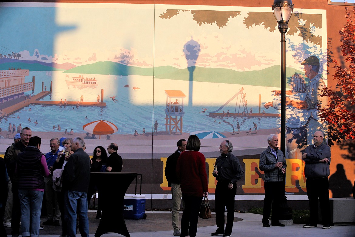 Guests mingle at Coeur d'Alene Rotary Centennial Park during the grand opening on Wednesday.